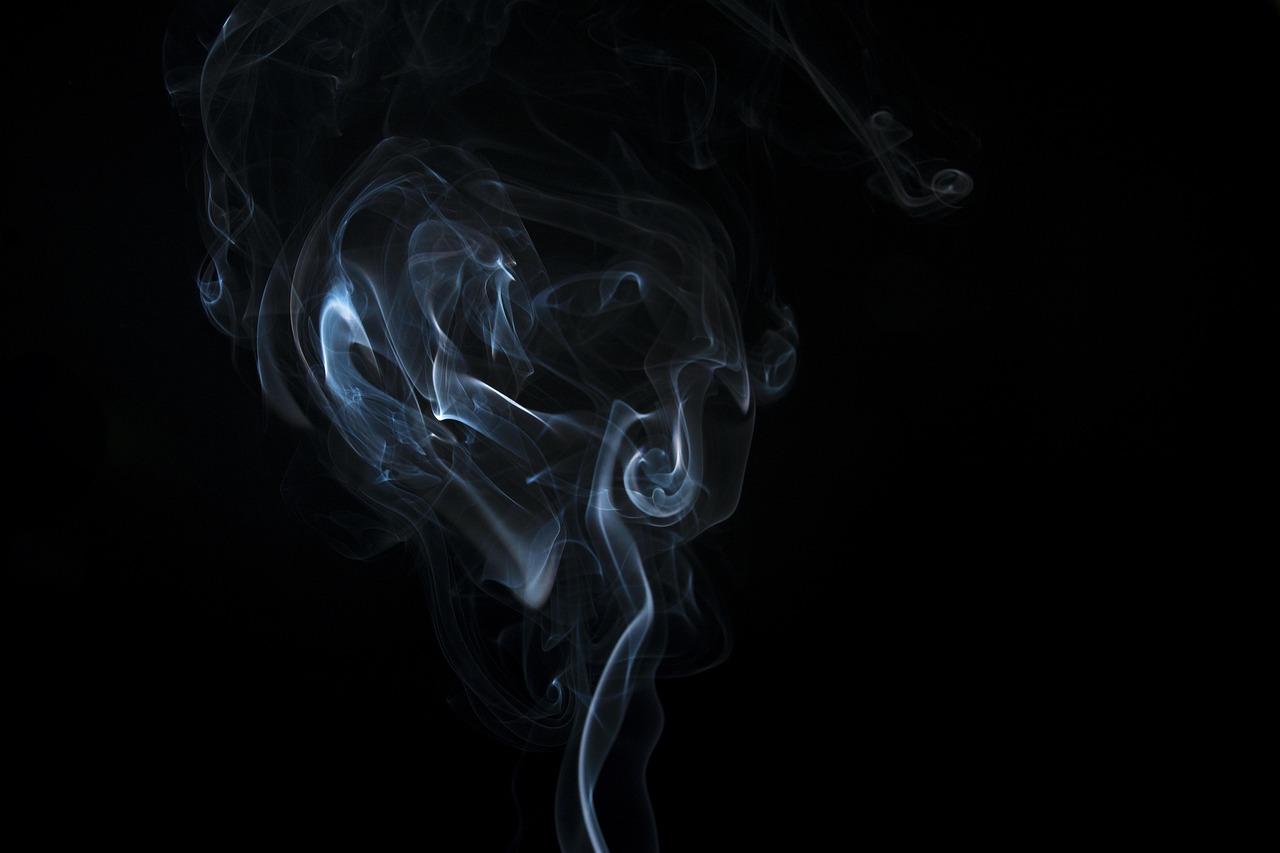 incense smoke on a black background