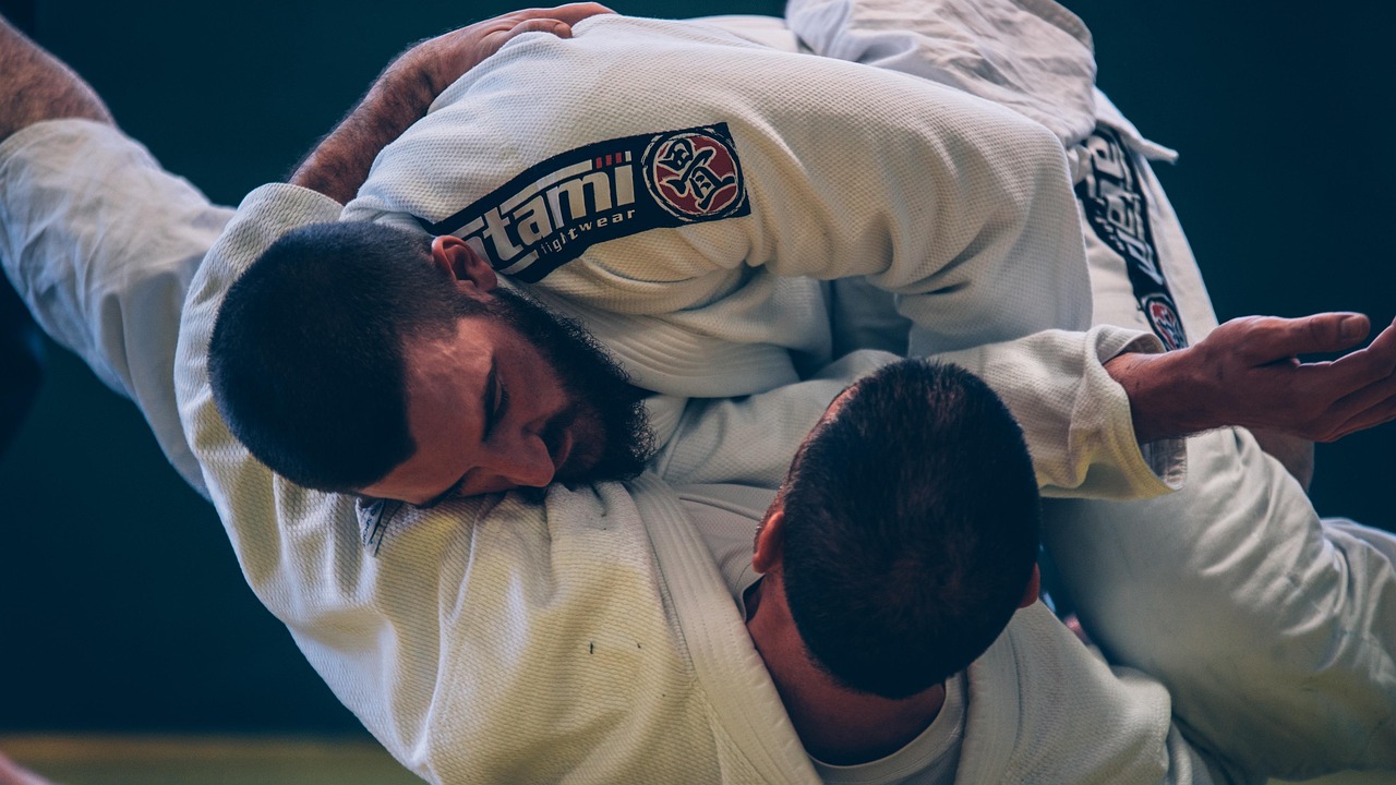 two men practicing brazillian jiu jitsu