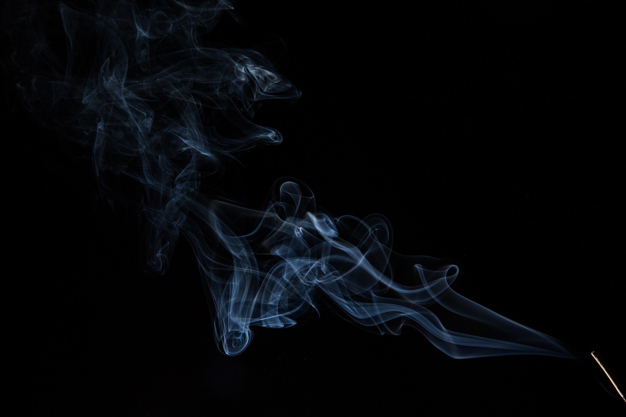smoke flowing from an incense stick