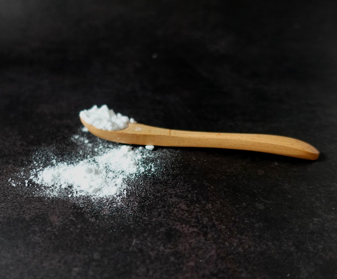 baking soda on a wooden spoon