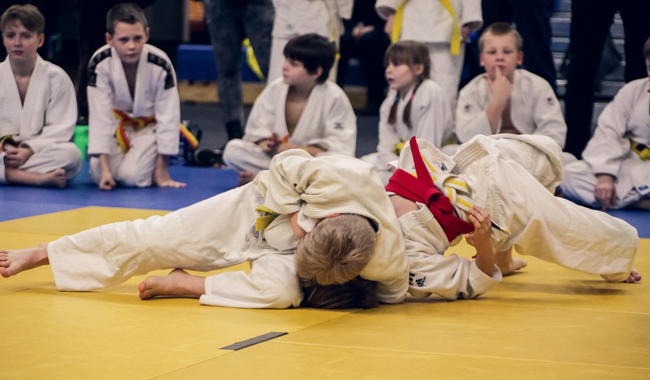 young judo athletes competing in a tournament