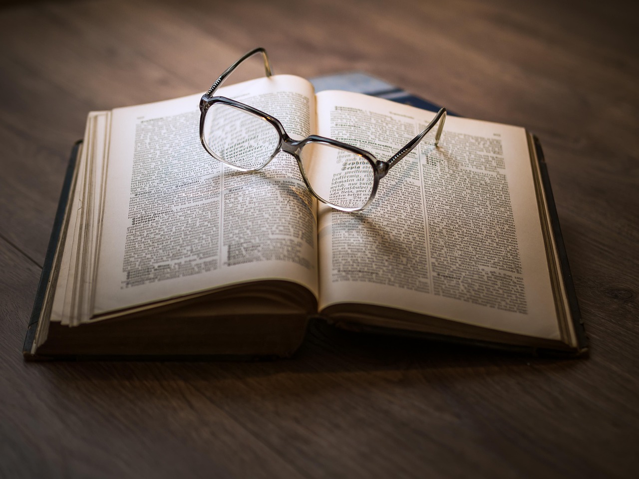 glasses resting on a book