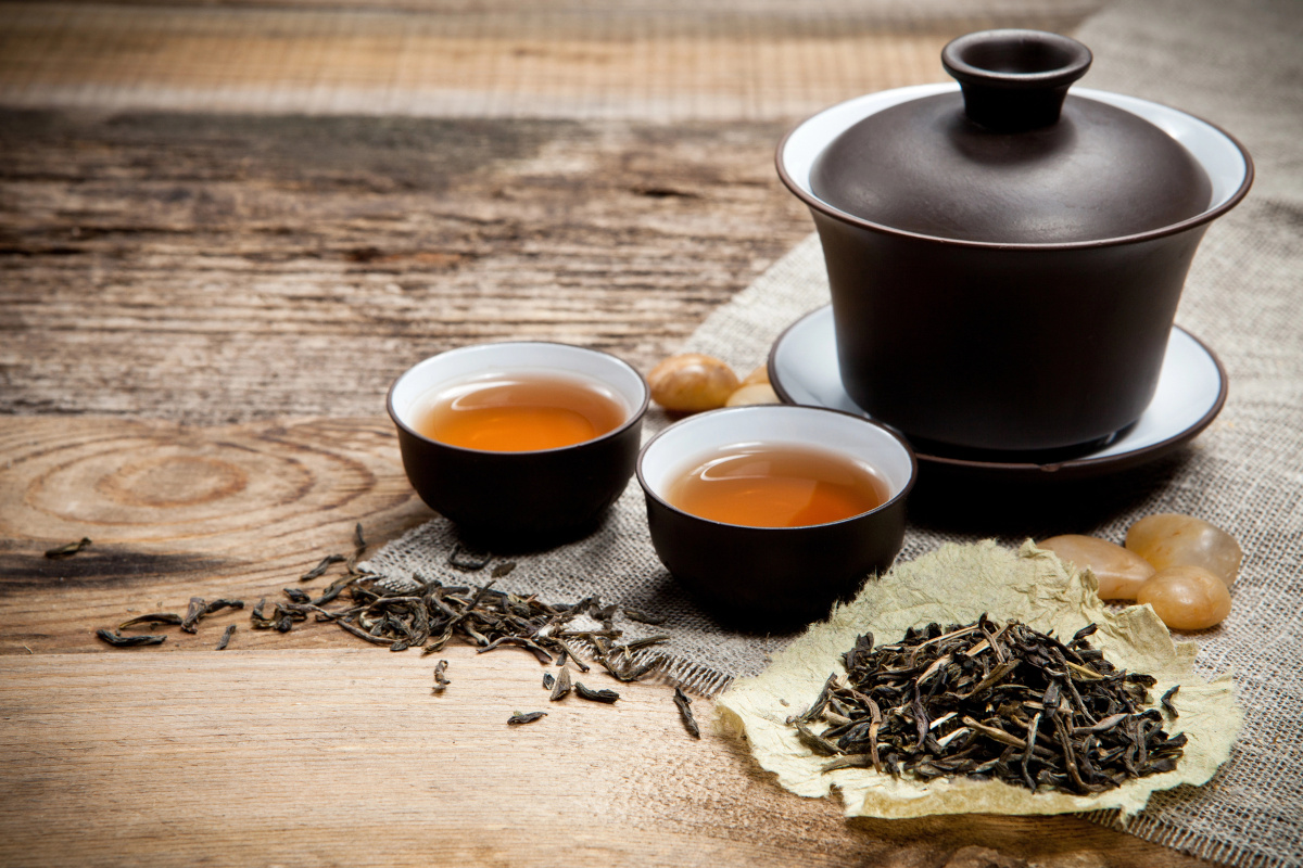 gaiwan and teacups on a wooden table