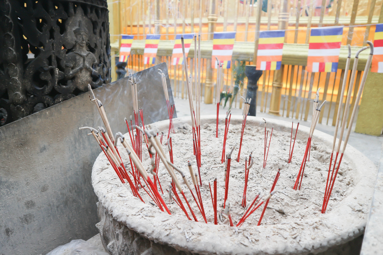 red incense sticks burning outside