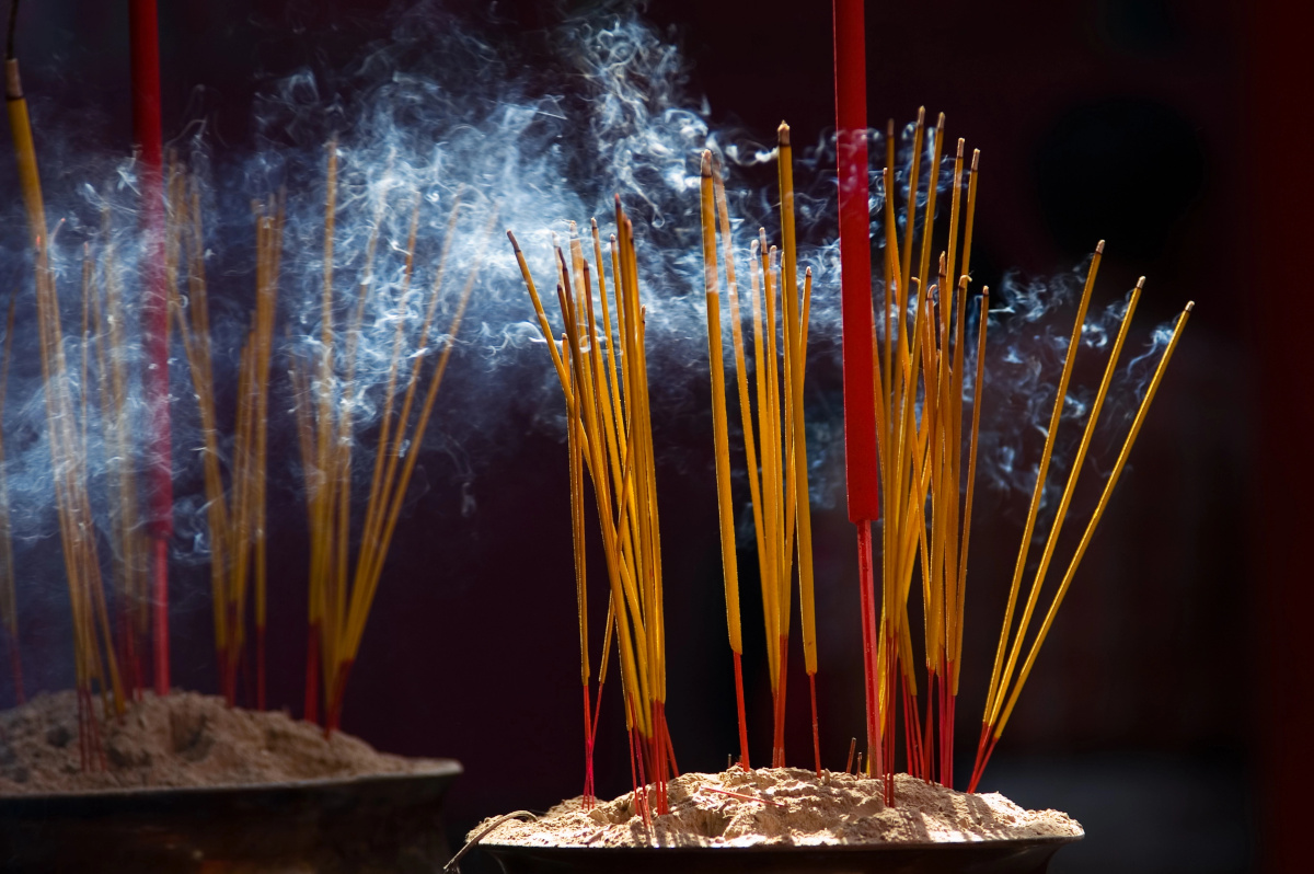 yellow and red incense sticks
